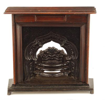 Appraisal: A Victorian cast iron miniature fireplace with a mihrab design