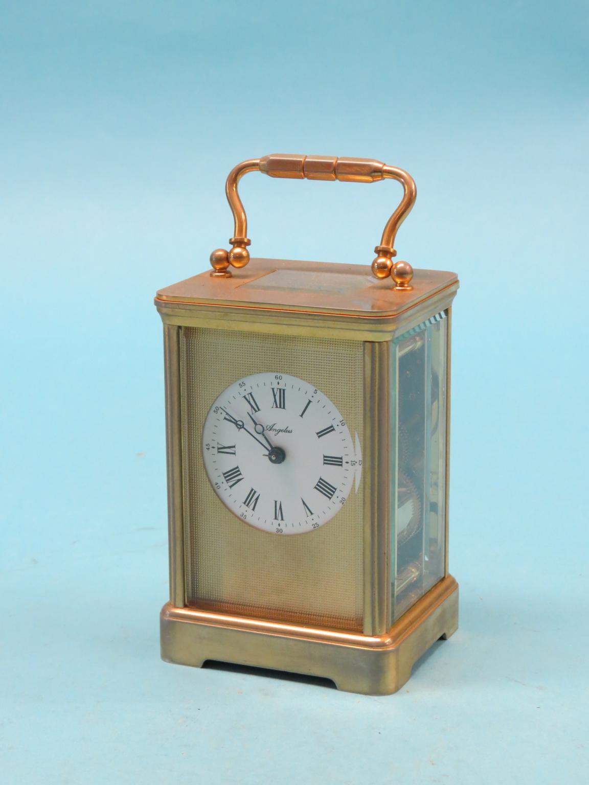 Appraisal: An Angelus brass carriage clock with bell-striking movement in