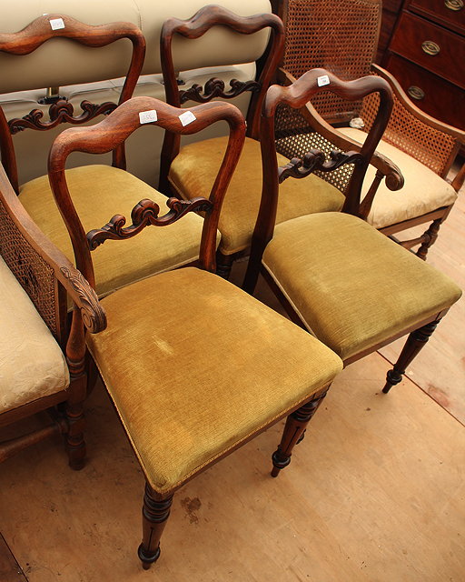 Appraisal: A SET OF FOUR VICTORIAN ROSEWOOD DINING CHAIRS with horizontal