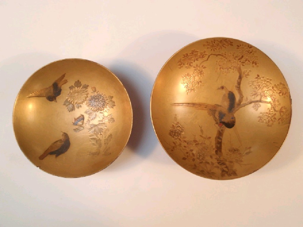 Appraisal: A Japanese gilt and red lacquered shallow circular dish painted