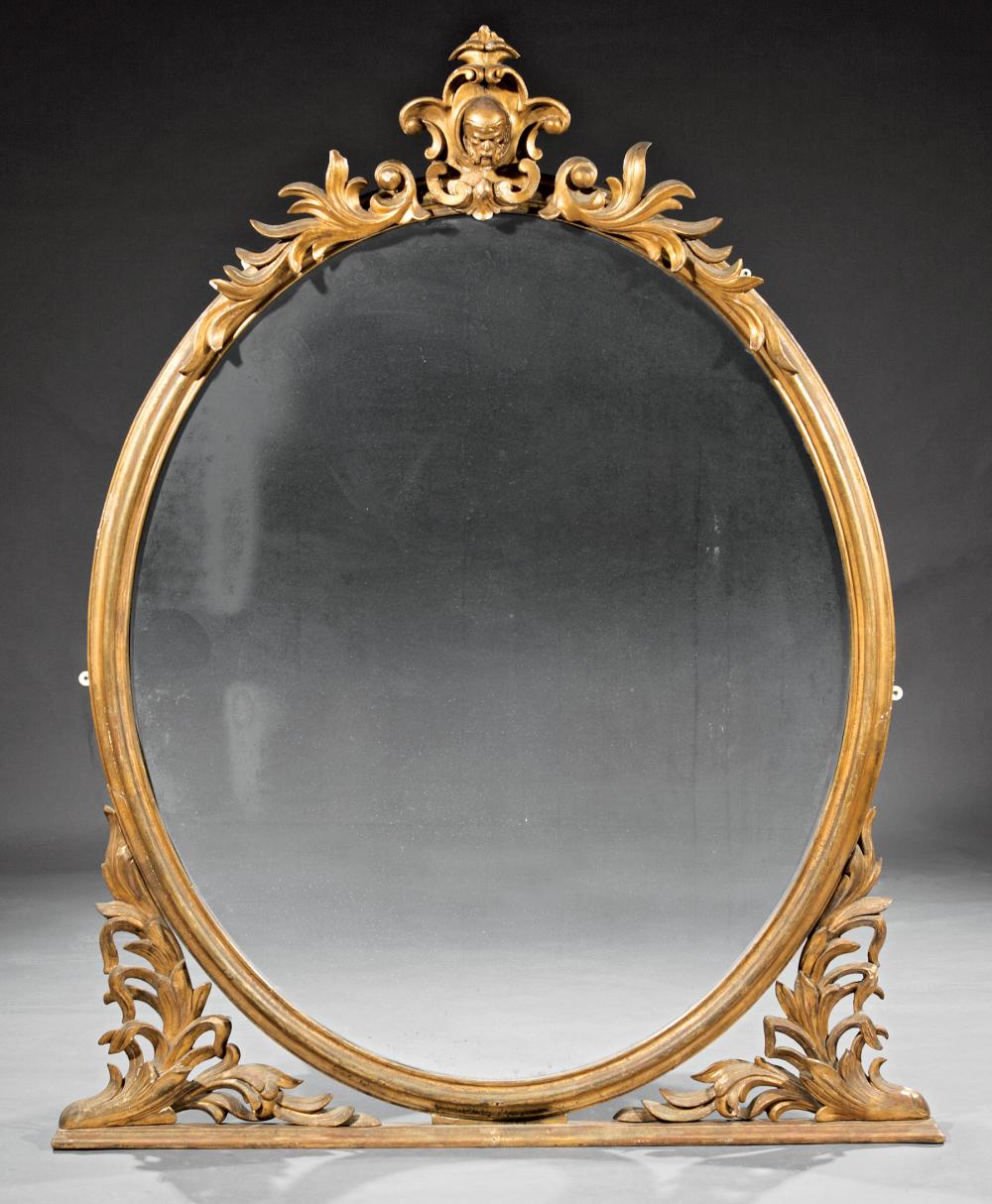 Appraisal: Monumental American Giltwood Overmantel Mirror th c oval mirror surround