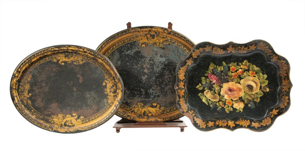 Appraisal: Two Graduated Antique Tole Peinte Trays black with gilt decoration