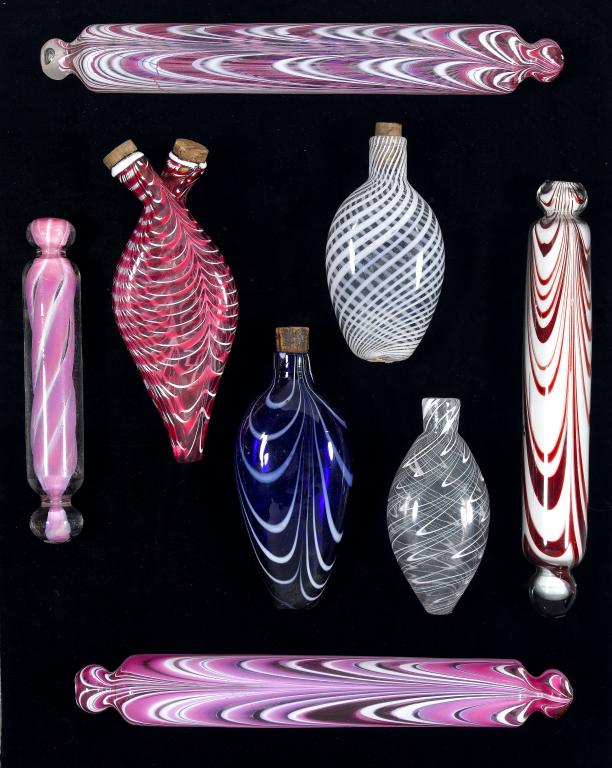 Appraisal: THREE VICTORIAN PINK AND WHITE NAILSEA STYLE GLASS ROLLING PINS