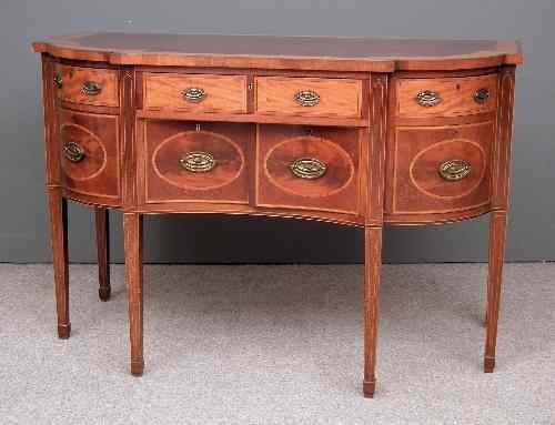 Appraisal: An Edwardian mahogany bow and break-front sideboard of Georgian design