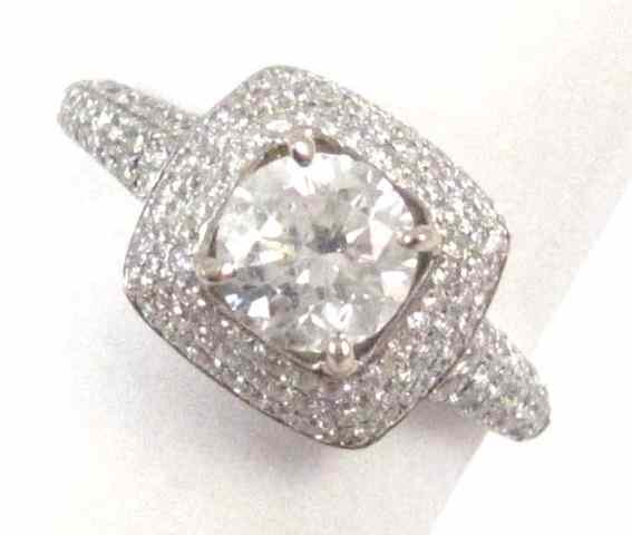 Appraisal: DIAMOND AND FOURTEEN KARAT WHITE GOLD RING featuring a round