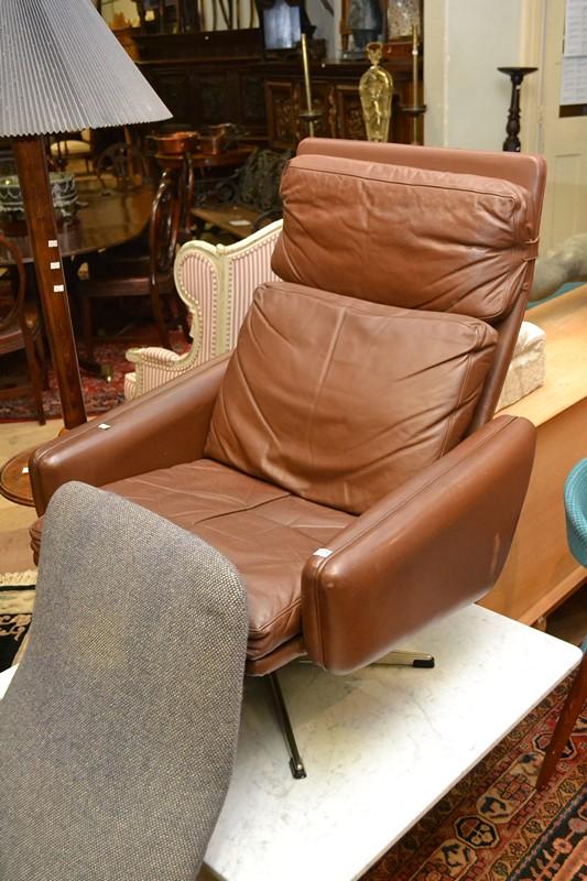 Appraisal: A DANISH LEATHER ARMCHAIR ON SWIVEL BASE A DANISH LEATHER