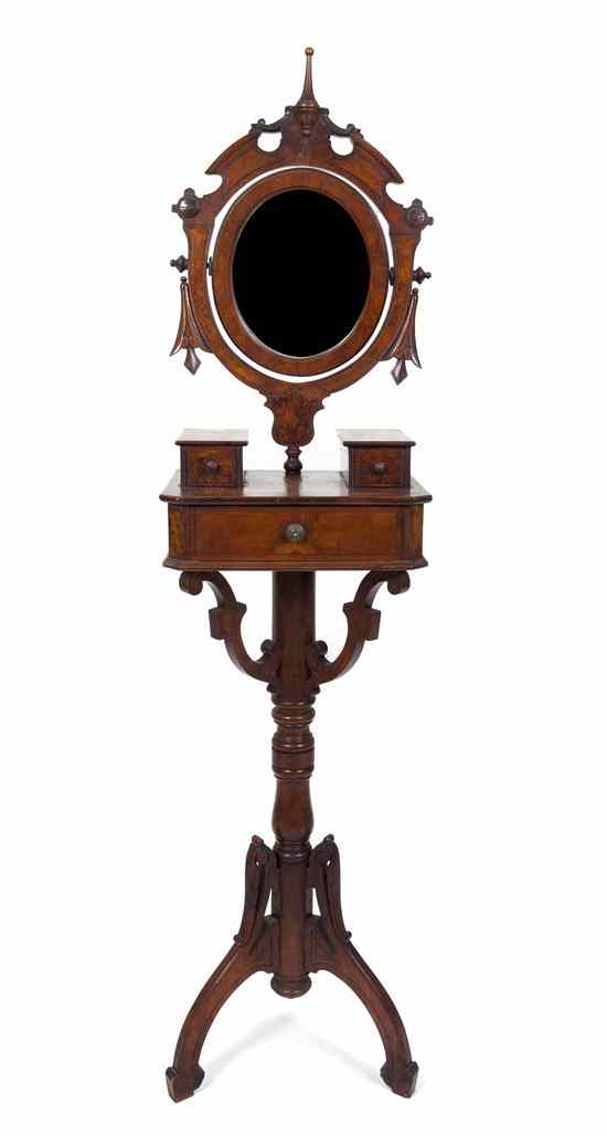 Appraisal: A Victorian Dressing Mirror the oval plate within a carved