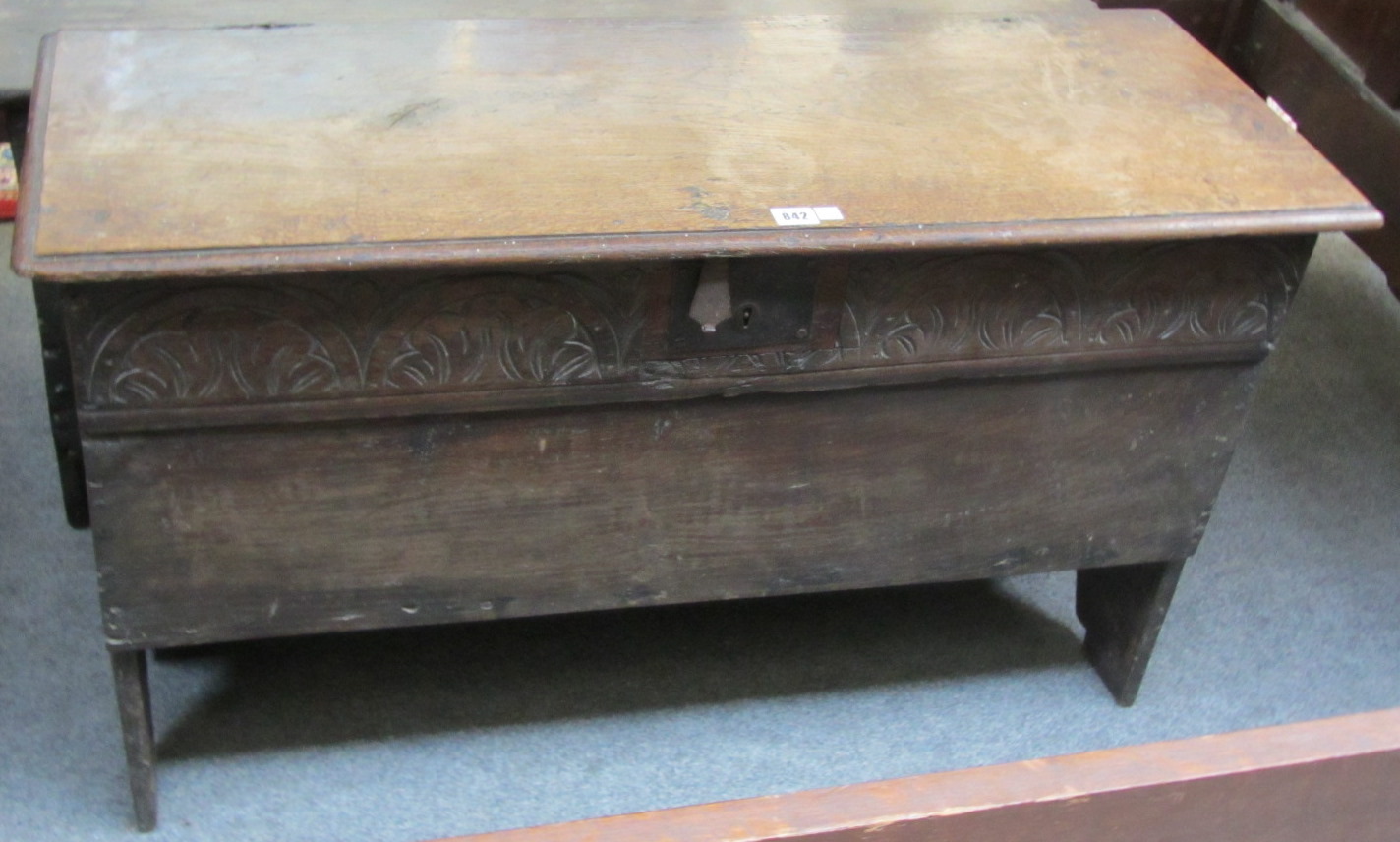 Appraisal: A th century oak five pank coffer with carved lunette