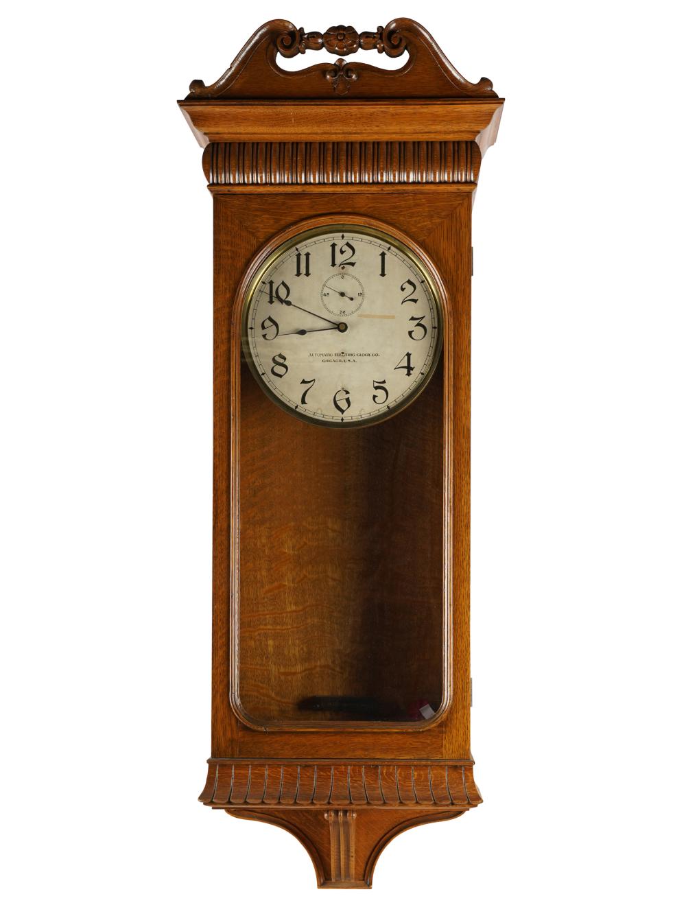 Appraisal: AUTOMATIC ELECTRIC CLOCK CO OAK WALL CLOCKwith pendulum no weights