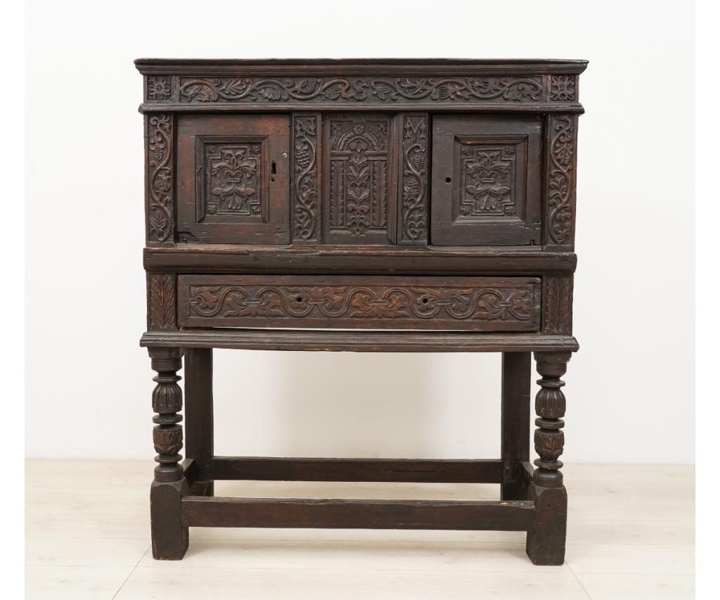 Appraisal: English oak cabinet th c with extensive floral and grape