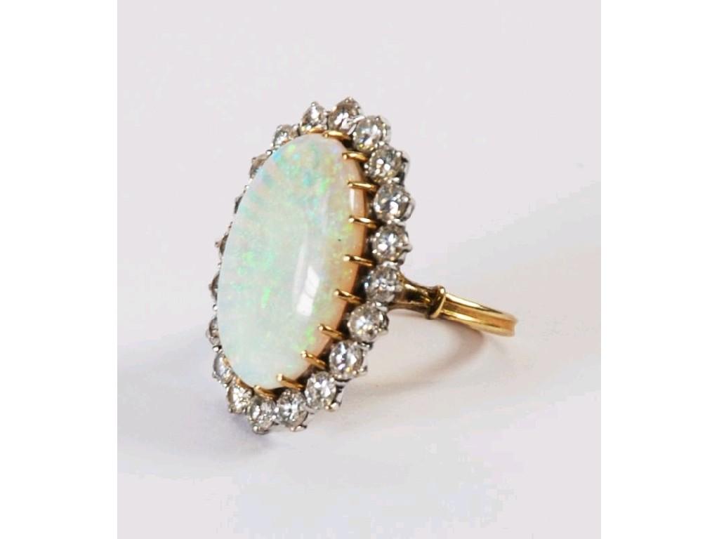 Appraisal: LARGE OPAL AND DIAMOND CLUSTER RING set with a large