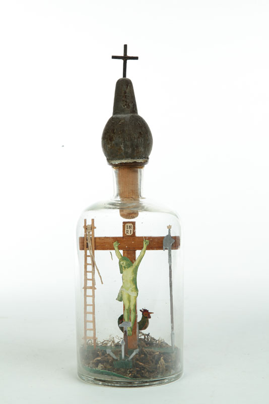 Appraisal: BOTTLE WHIMSEY Slovenia glass wood paper and moss Crucifixion scene