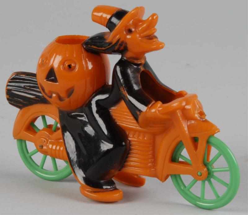 Appraisal: Plastic Halloween Witch on Motorcycle Description Circa Pumpkin in back