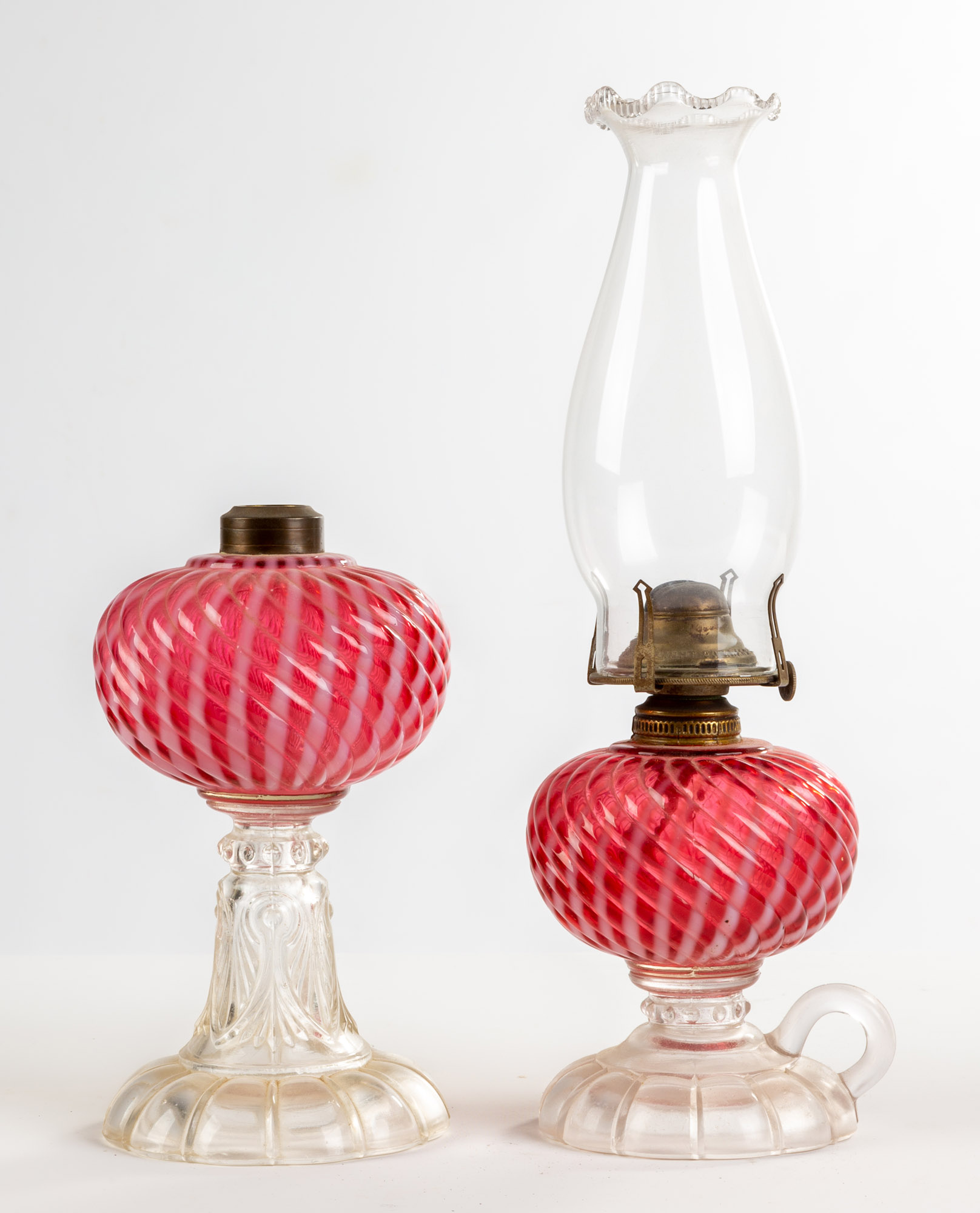 Appraisal: TH CENTURY PINK OPALESCENT SWIRL OIL LAMPS th Century Pink