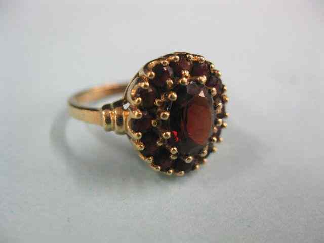 Appraisal: Garnet Ring oval gem surrounded by rounds gems in k