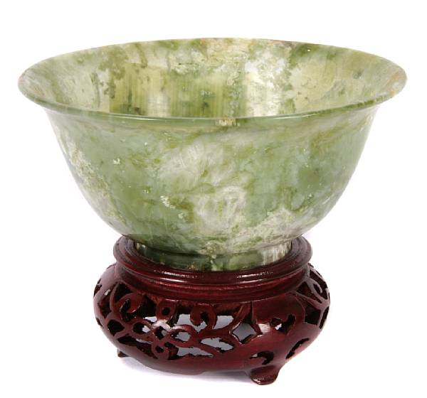 Appraisal: A Chinese spinach green jade low bowl on stand height