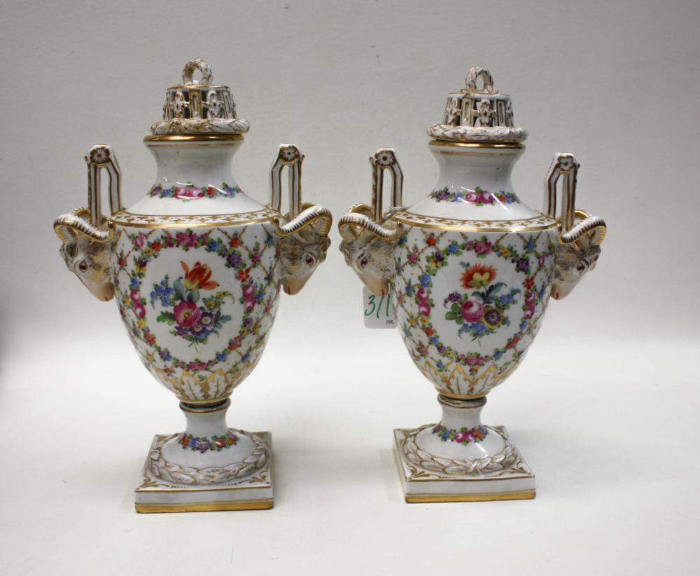 Appraisal: PAIR OF DRESDEN PORCELAIN LIDDED URNS with reticulated lids and