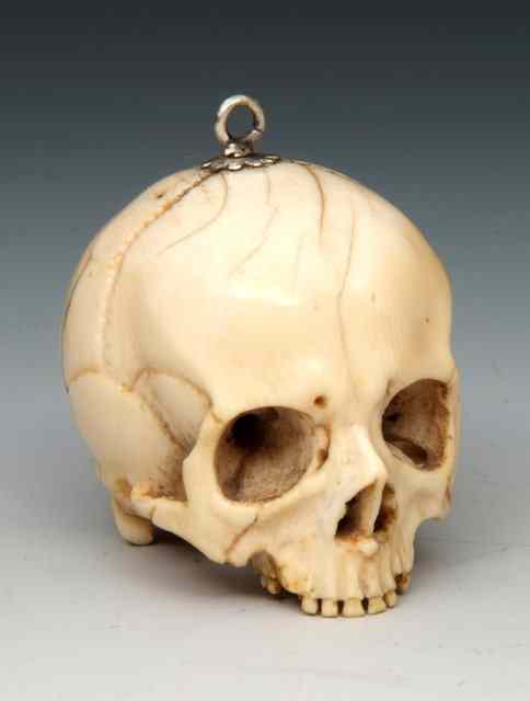 Appraisal: A TH CENTURY GERMAN CARVED IVORY MEMENTO MORI SKULL inscribed