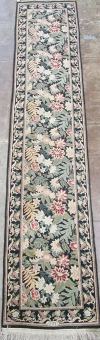 Appraisal: HAND KNOTTED ORIENTAL RUNNER Pakistani-Persian overall foliate design on black