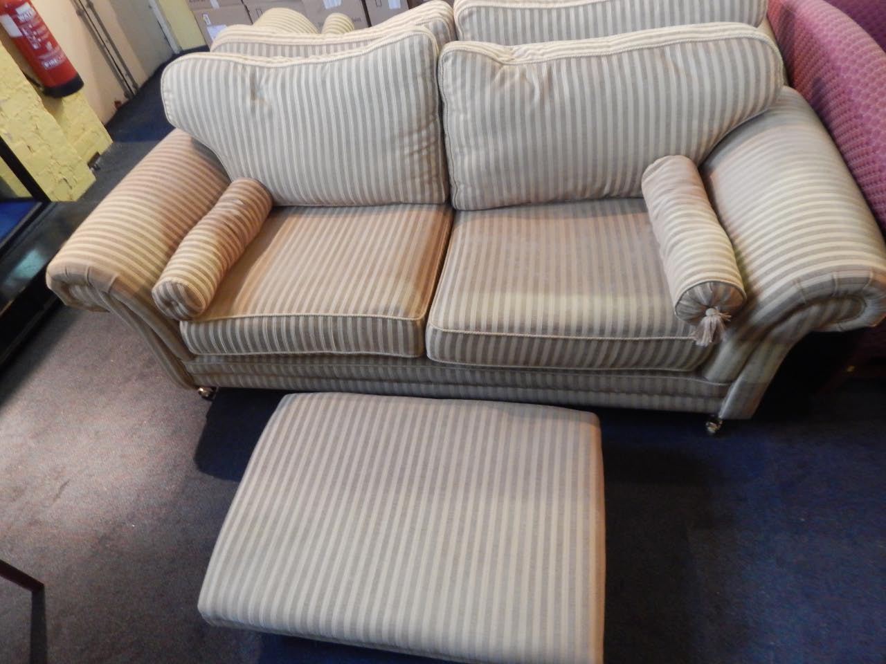 Appraisal: A pair of large three seat sofas upholstered in gold