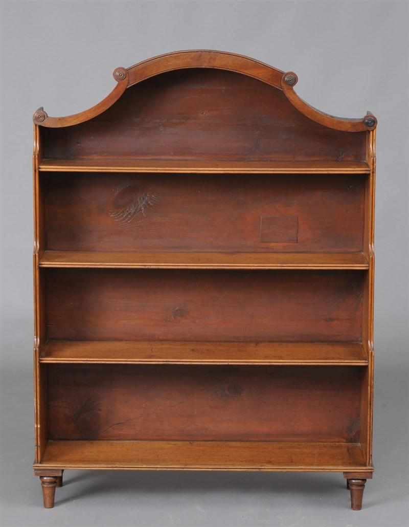 Appraisal: REGENCY MAHOGANY SMALL BOOKCASE The serpentine crest with applied ringed