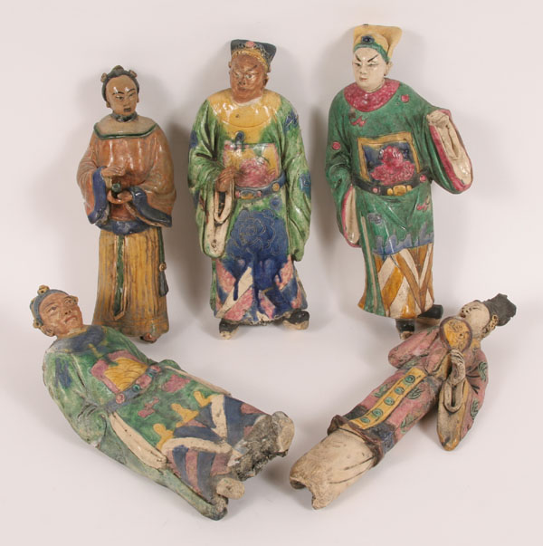 Appraisal: Glazed painted earthenware Chinese mudmen roof tiles two female figures