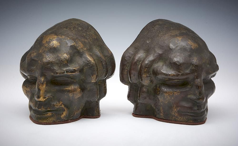 Appraisal: Pair of bronze bookends face of a man Rubinstein foundry