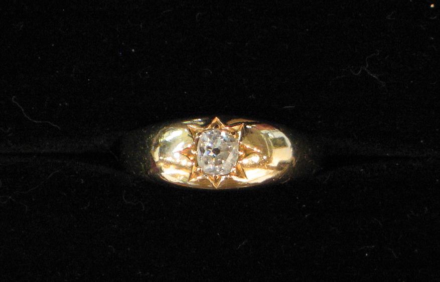 Appraisal: AN CT YELLOW GOLD GYPSY RING with an old-cut diamond