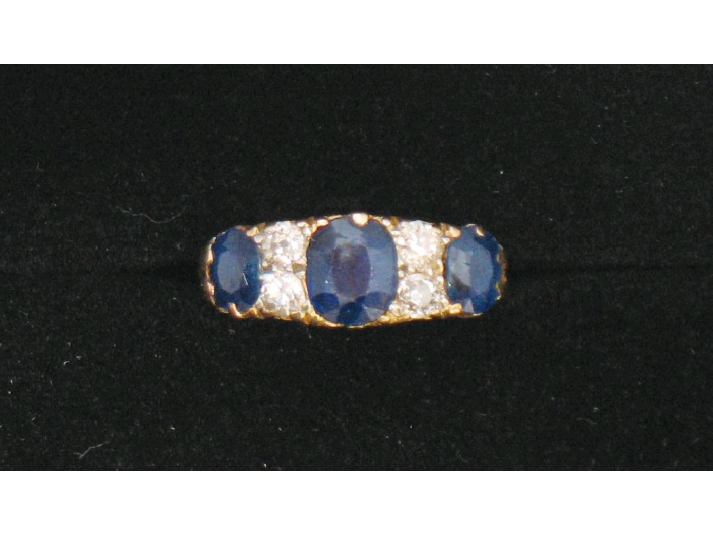 Appraisal: A SAPPHIRE AND DIAMOND DRESS RING the three graduated oval