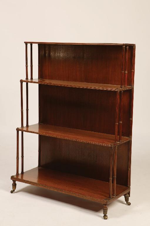 Appraisal: A REGENCY STYLE MAHOGANY WATERFALL BOOKCASE with four graduated shelves