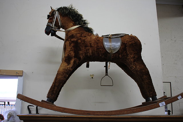 Appraisal: A VINTAGE BROWN PLUSH CHILD'S ROCKING HORSE cm wide