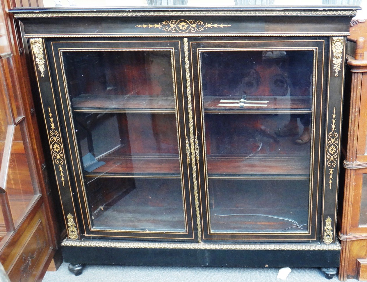 Appraisal: A th century gilt metal mounted ebonised two door display