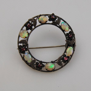 Appraisal: Arts Crafts open wreath-style brooch set alternate pale opals and