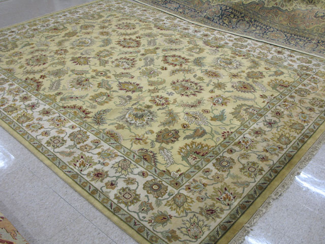 Appraisal: INDO-PERSIAN CARPET overall floral design on saffron ground ' x