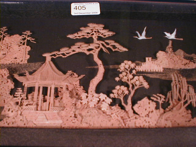 Appraisal: A Chinese carved cork picture of a pagoda in a