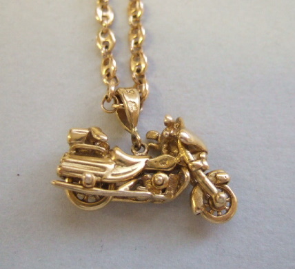 Appraisal: A ct gold pendant designed as a motorbike with a