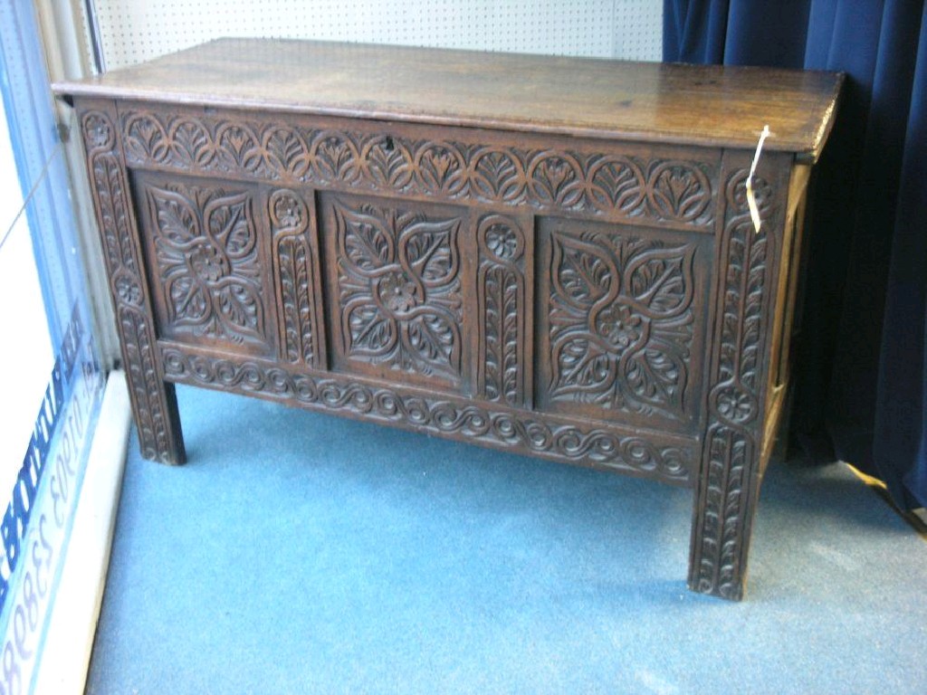 Appraisal: A late th century oak coffer boarded top enclosing interior