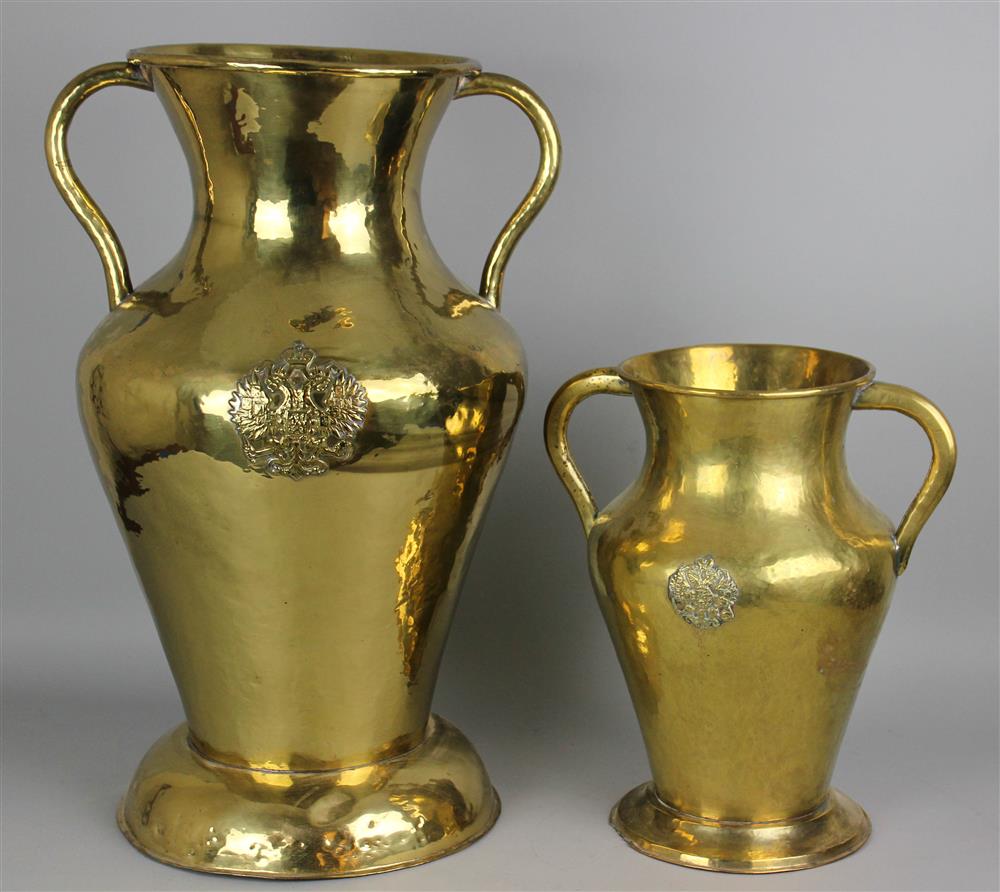 Appraisal: TWO BRASS URNS WITH HANDLES the larger brass urn is