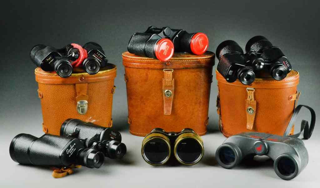 Appraisal: Pair Binoculars and Leather CasesTo include Tasco Binolux and antique