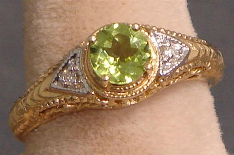 Appraisal: K YG filigree peridot ring size dwt Estimate -