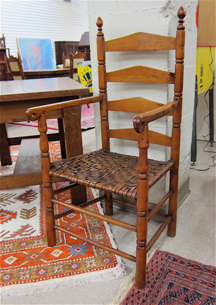 Appraisal: COUNTRY LADDER-BACK ARMCHAIR American late th early th century having