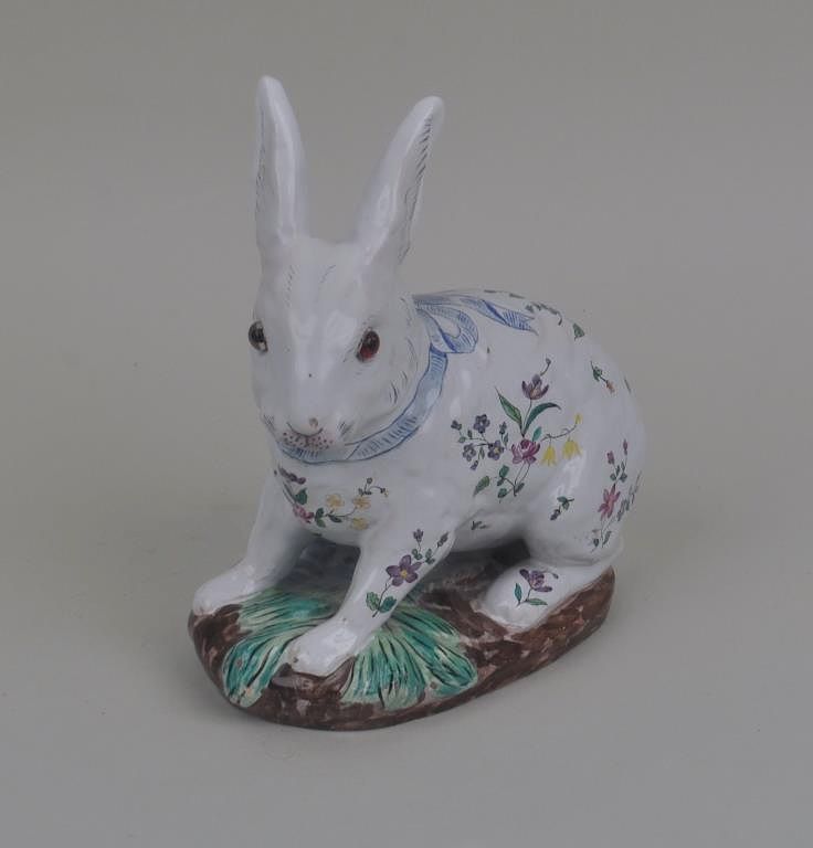 Appraisal: An Emile Galle' Pottery Rabbit Vase wearing a blue ribbon