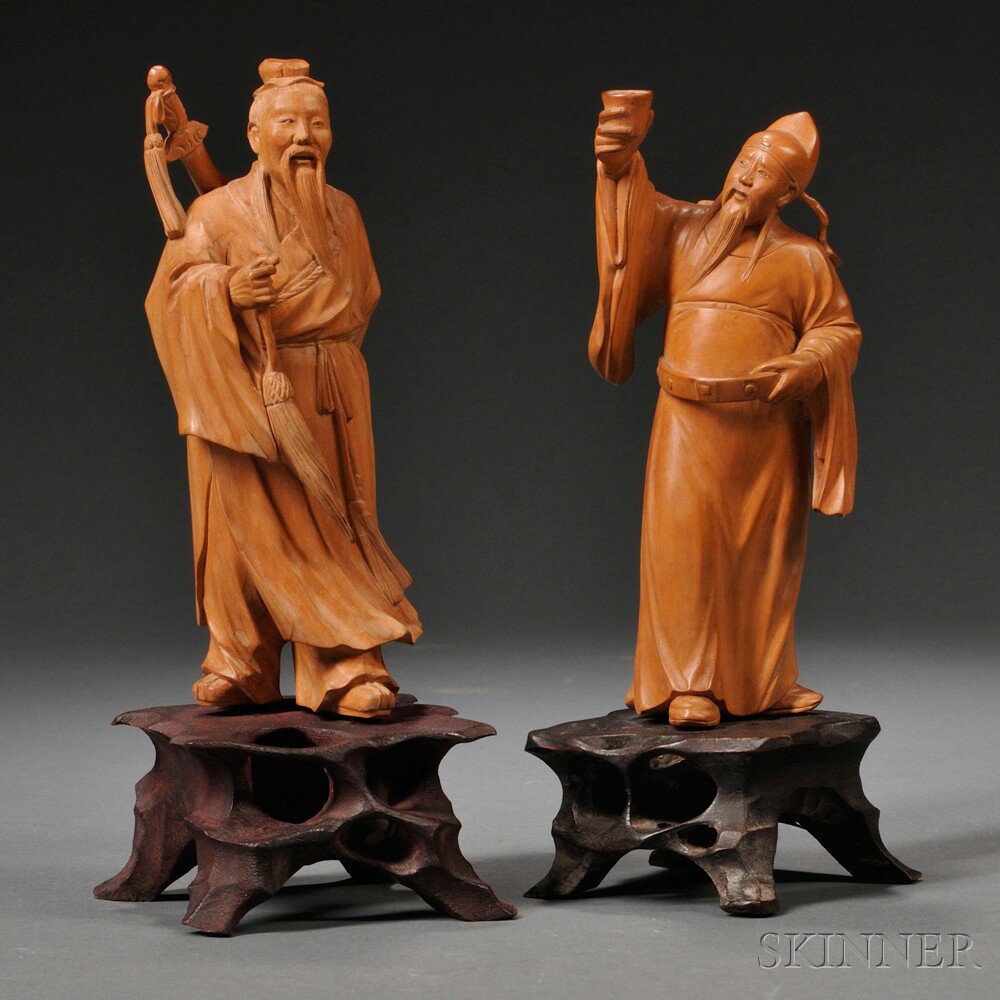 Appraisal: Two Carved Wood Figures of Men China one standing with