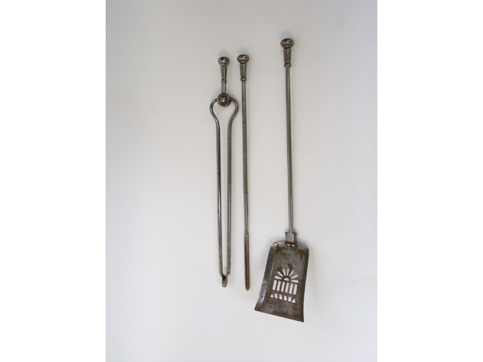 Appraisal: A good quality steel fireside trio consisting of tongs shovel