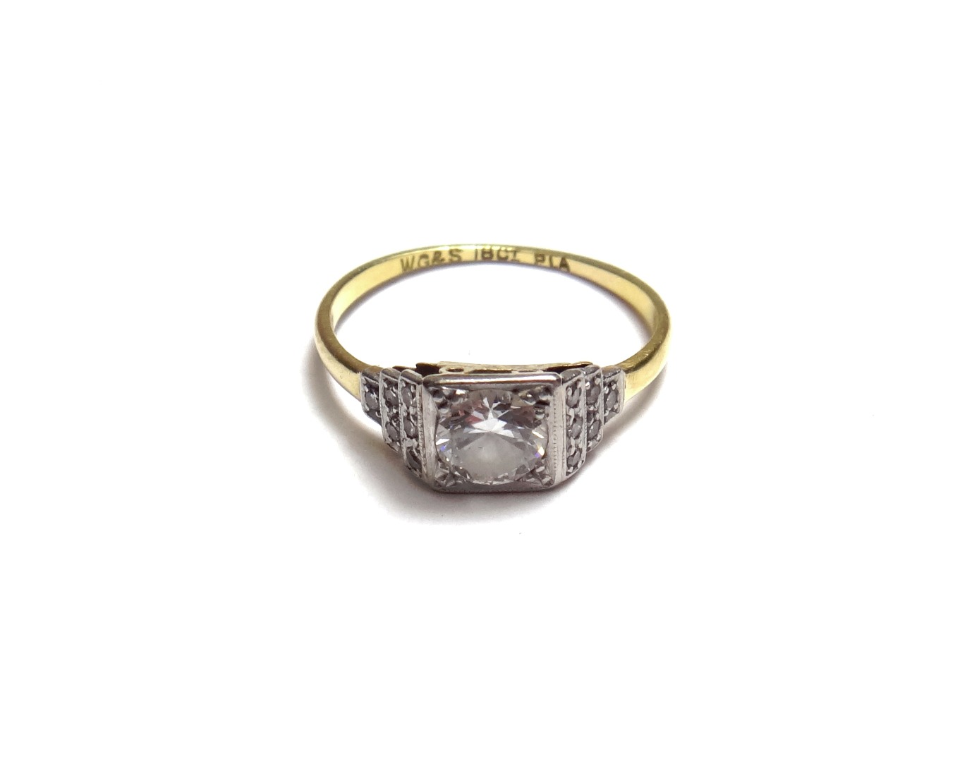 Appraisal: A gold and platinum diamond set ring mounted with the