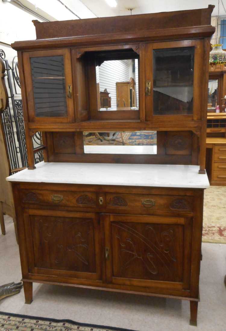 Appraisal: CARVED WALNUT SIDEBOARD Belgian early th century in two sections