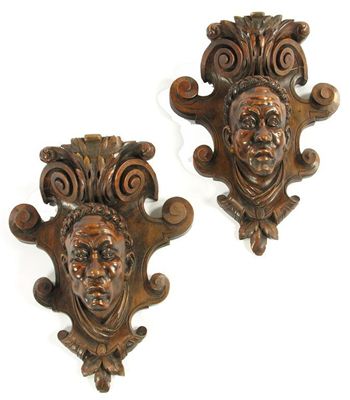 Appraisal: A pair of carved and stained wood Black Forest type