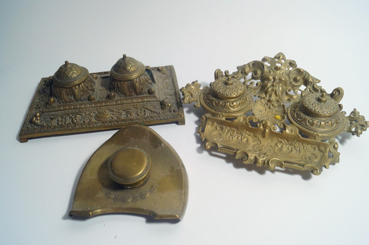 Appraisal: Victorian and later brass desk stands and inkwells an Egyptian