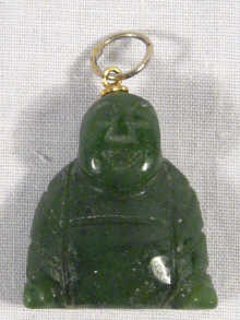 Appraisal: A gold mounted pendant in the form of a jade