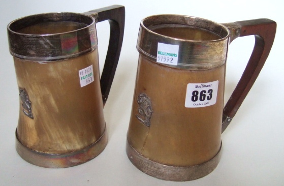 Appraisal: Two Victorian silver mounted horn mugs each with an applied